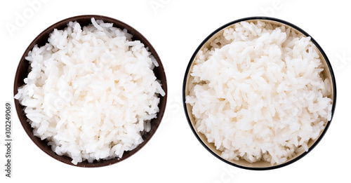 Fényképezés Rice in a bowl on a white background. top view