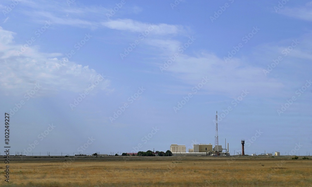 industrial landscape with field and blue sky industrial landscape with field and blue sky