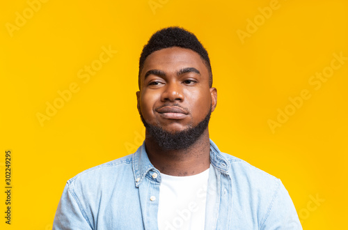 Portrait of african american man with sceptical face expression