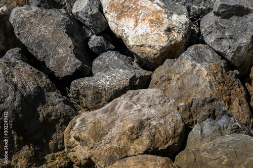 Big rocks on a beach in a sunlight.