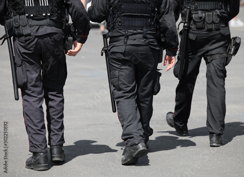 three cops patroling the road