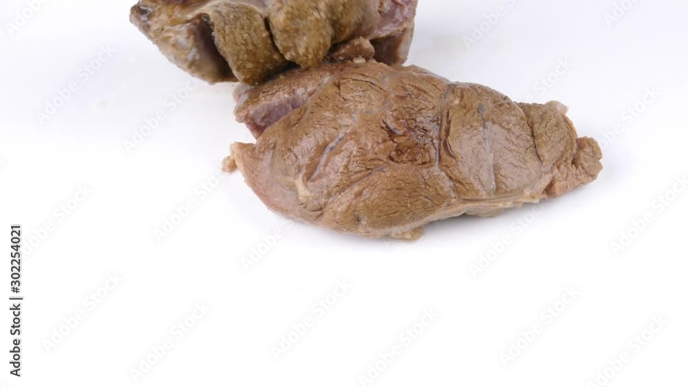 putting cooked beef shanks on a white plate closeup 4k putting cooked beef shanks on a white plate closeup 4k