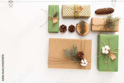 Christmas composition made of pine cones, brunches, tree rings, crafted gifts with no plastic on white table. Christmas, Xmas, winter, new year, Zero waste concept.Top view, copy space, flat lay.