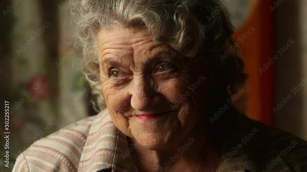 Smile and happy elderly woman with blinking eyes slow motion Smile and happy elderly woman with blinking eyes slow motion