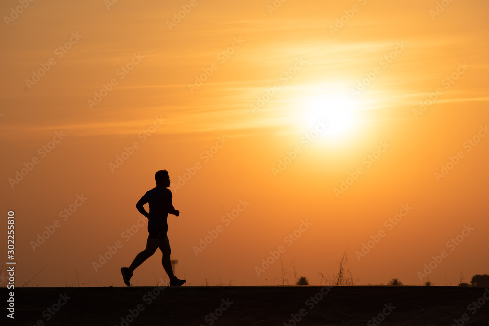 Silhouette man running on sunset background Silhouette man running on sunset background
