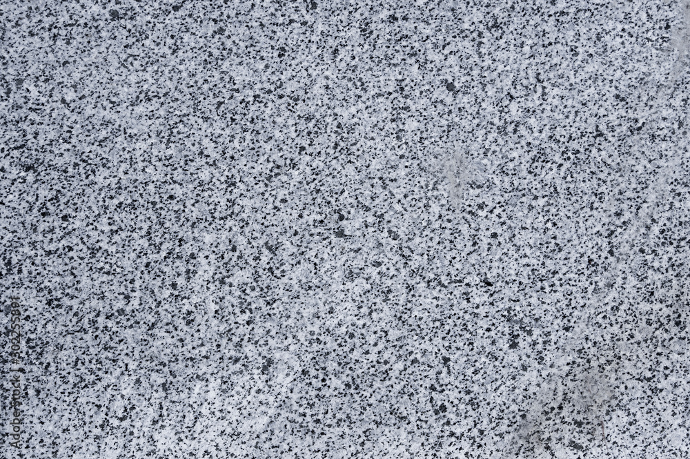 Closeup of grey polished granite texture background. Closeup of grey polished granite texture background.