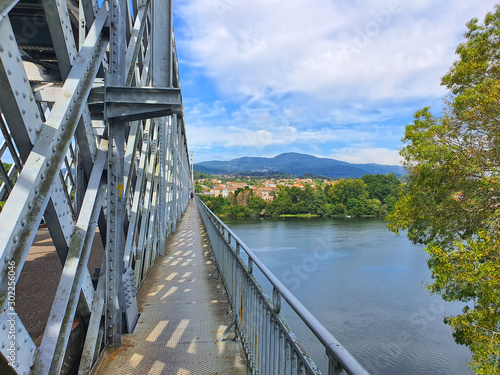 Metal bridge over Minho river photo