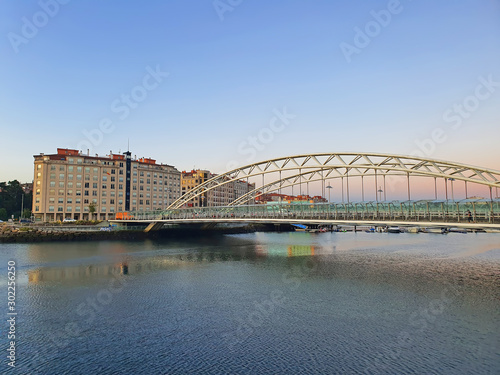 Modern arch bridge on Lerez river photo