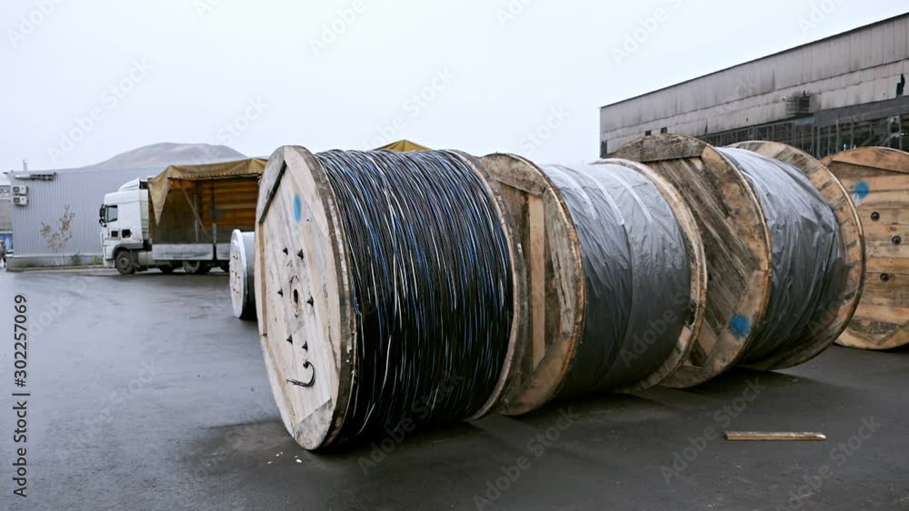 The manufacture of ropes. A bunch of ropes. High voltage cable reel.Electrical Pole to Wire Roll Pull Focus The manufacture of ropes. A bunch of ropes. High voltage cable reel.Electrical Pole to Wire Roll Pull Focus