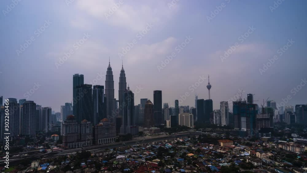 Time Lapse Of Kuala Lumpur Skyline During Haze Overlooking Cityscape. 4K. Prores. Time Lapse Of Kuala Lumpur Skyline During Haze Overlooking Cityscape. 4K. Prores.