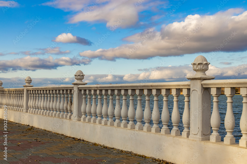 classic pillar marble fence perspective architecture dock waterfront background in clear weather day time and blue sky white clouds, copy space 