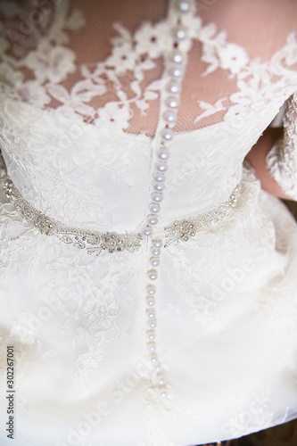 a beautiful white wedding dress closeup shot