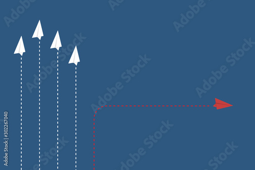 Different Approach - Different Direction. Group of paper airplane in one direction and with one individual pointing in the different way, can be used leadership/individuality/innovation concepts.