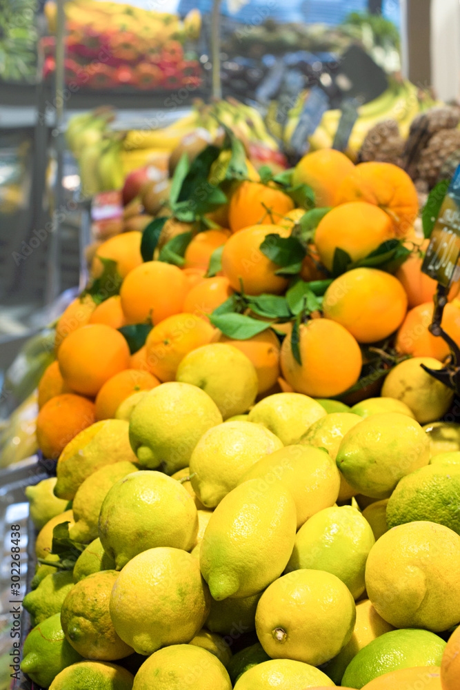 Fresh citrus fruits in supermarket. Concept of healthy food, bio, vegetarian, diet.