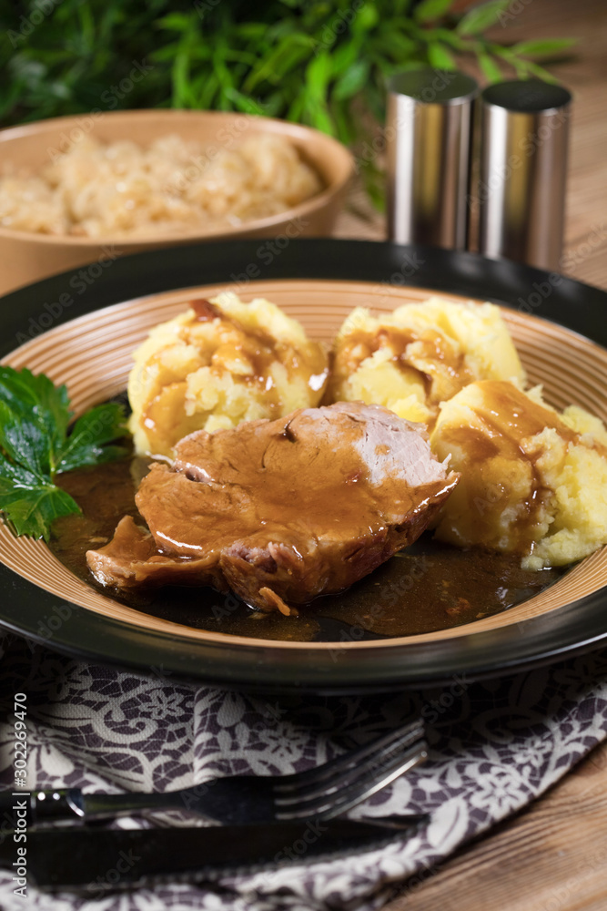 Braised pork neck in own sauce. Shallow depth of field. Braised pork neck in own sauce. Shallow depth of field.