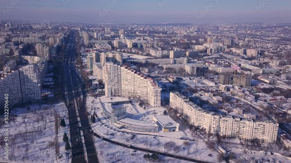 Top view of city in winter at sunset on sky background. Aerial drone videography concept. 4K. Kishinev, Republic of Moldova. Top view of city in winter at sunset on sky background. Aerial drone videography concept. 4K. Kishinev, Republic of Moldova.