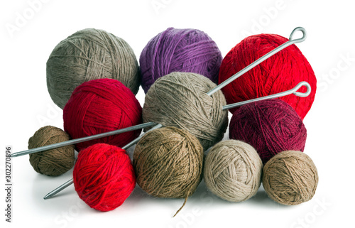 Balls of yarn in different colors with knitting needles. Isolated on white background.