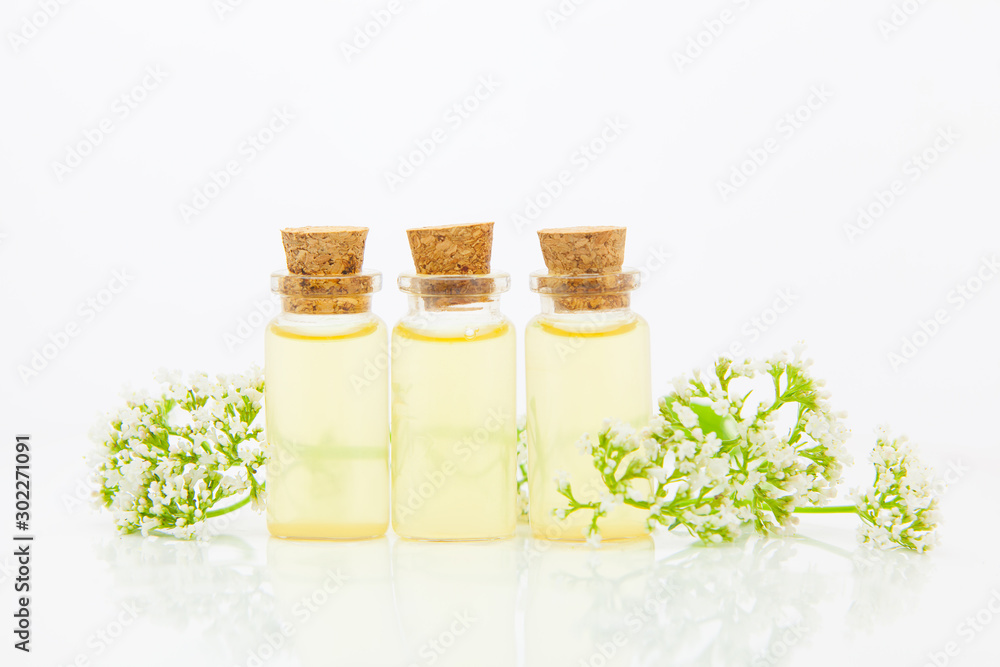 Essence of flowers on table in beautiful glass jar Essence of flowers on table in beautiful glass jar