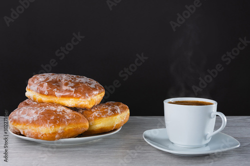 donuts on with cup of hot espresso