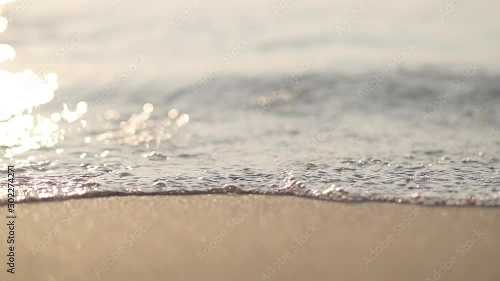 Sandy Eastern beach with rolling calm waves. Sunny summer morning or evening. Beautiful Turkish marine nature. Sandy Eastern beach with rolling calm waves. Sunny summer morning or evening. Beautiful Turkish marine nature.