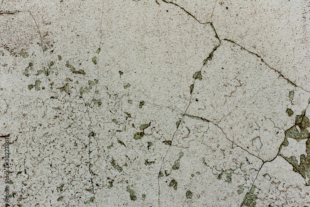 Obraz premium Texture of a concrete wall with cracks and scratches which can be used as a background