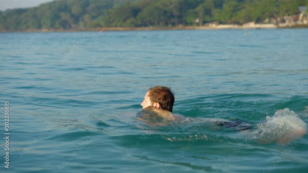 Man Swimming in Tropical Ocean