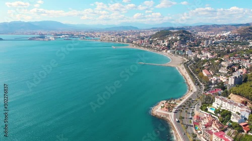 Drone shot - 4K - Aerial view of Málaga (Spain) city of Costa del Sol with the beach and buildings in a sunny day