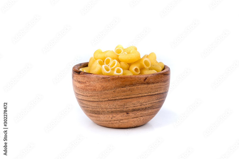 PIle of yellow dried elbow macaroni pasta shapes PIle of yellow dried elbow macaroni pasta shapes