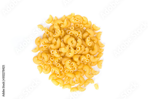 PIle of yellow dried elbow macaroni pasta shapes