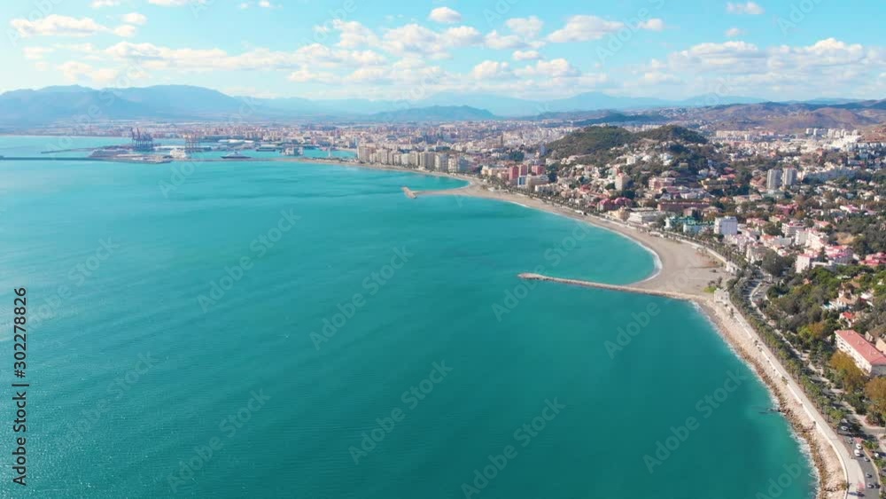 Drone shot - 4K - Aerial view of Málaga (Spain) city of Costa del Sol with the beach and buildings in a sunny day Drone shot - 4K - Aerial view of Málaga (Spain) city of Costa del Sol with the beach and buildings in a sunny day