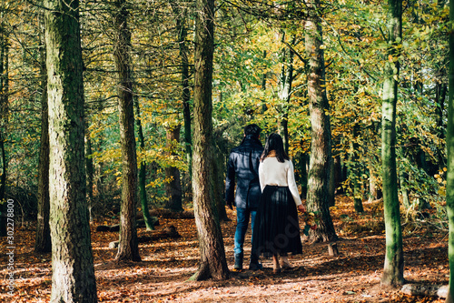 Couple walking through the woods