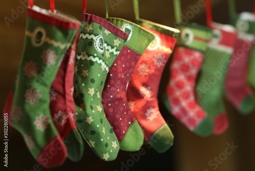 Traditional advent calendar with red and green Santa Claus socks as decoration