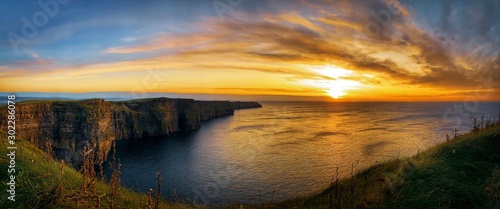sunset over Cliffs of Moher, Ireland photo