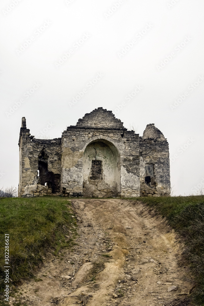 Ruins of an ancient Christian temple. The road leading up to the old dilapidated church.