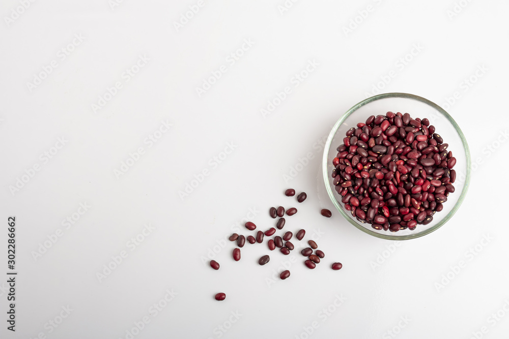 Dried beans in a round glass plate on a white background Dried beans in a round glass plate on a white background