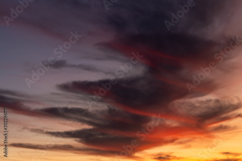 dramatic sky with Spiral clouds. Reds and oranges fill the picture
