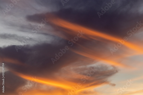 dramatic sky with Spiral clouds. Reds and oranges fill the picture