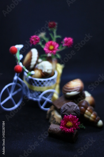 composition with chocolate and flowers