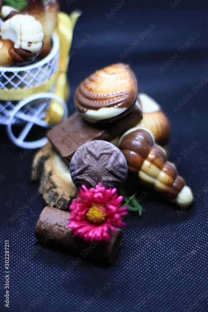 composition with chocolate and flowers composition with chocolate and flowers