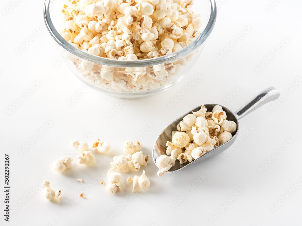 Scoop of white cheddar popcorn. Scoop of white cheddar popcorn.