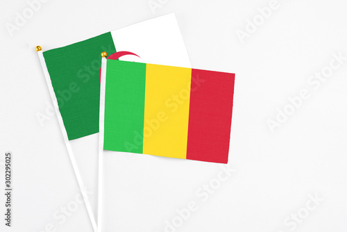 Free Download Mali and Algeria stick flags on white background. High quality fabric, miniature national flag. Peaceful global concept.White floor for copy space. - GFXLoad