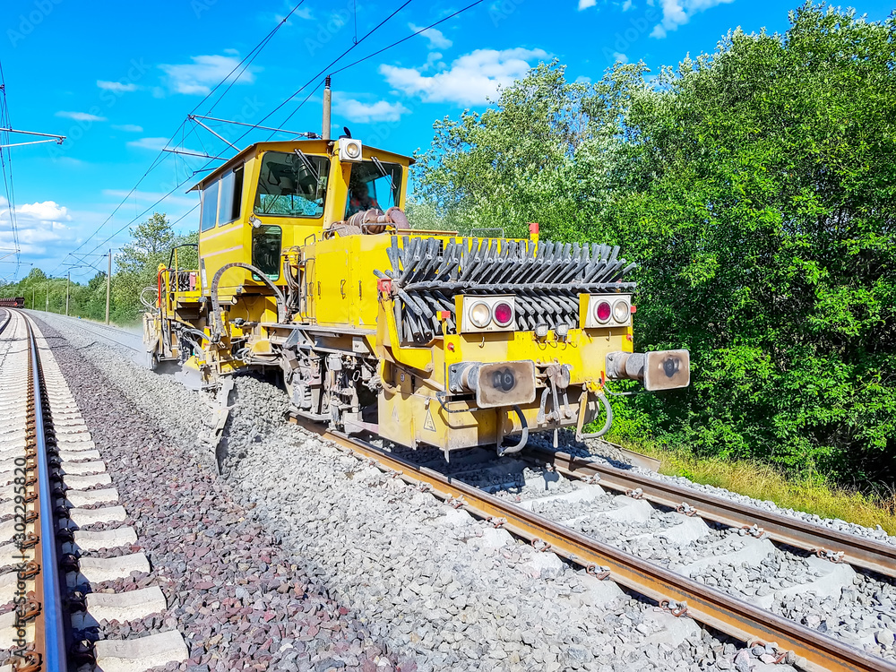 Heavy machinery repairs rail lines