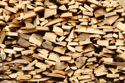 Obraz na płótnie Chopped wood, stacked in a woodpile. w salonie