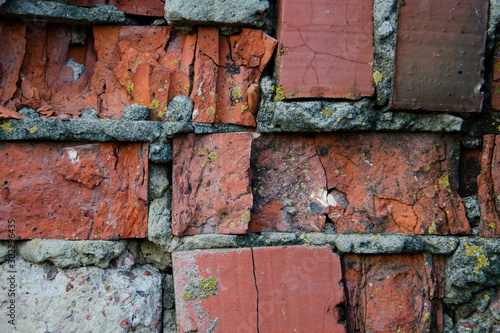 Old brick wall, cracked cinder block
