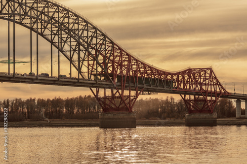 Bridge "Red Dragon" over Irtysh river in the Khanty-Mansiysk in sunset