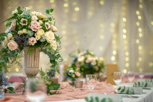 wedding table with flowers and decorations, wedding centerpiece or event reception  photo