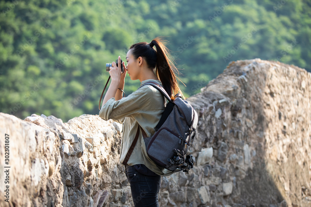 Chinese photographer taking photos in village Chinese photographer taking photos in village