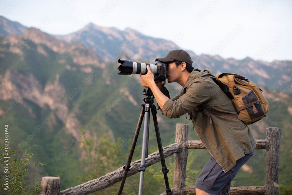 Chinese photographer taking photos outdoors Chinese photographer taking photos outdoors