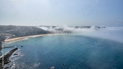 Portugal. Lagos. Fort Arrifana. Atlantic Misty wave rolls on a rocky shore