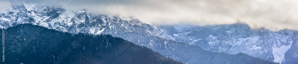 Obraz premium Panorama HDR of the Tatra Mountains and Zakopane in Poland, National Park, pictures taken in cloudy day.